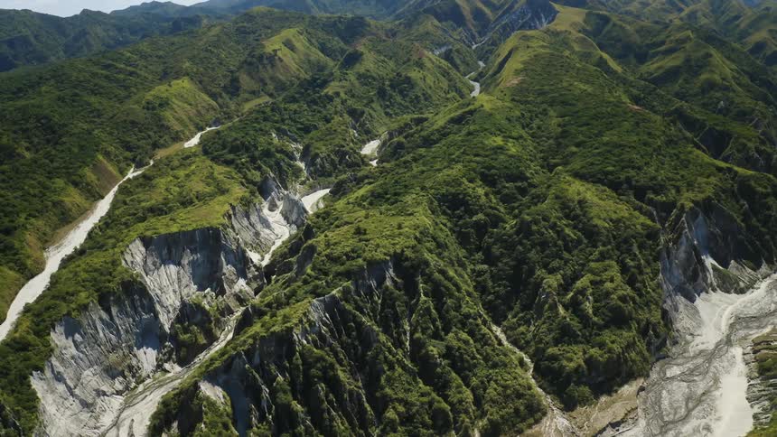 Mountain range covered in a lush carpet of green grasses