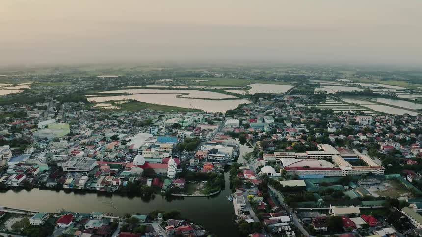An aerial view of a village with waterways traveling through it