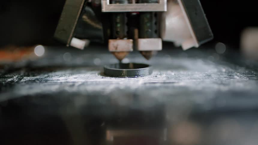 A piece of machinery in motion with an engine rotating around an iron object