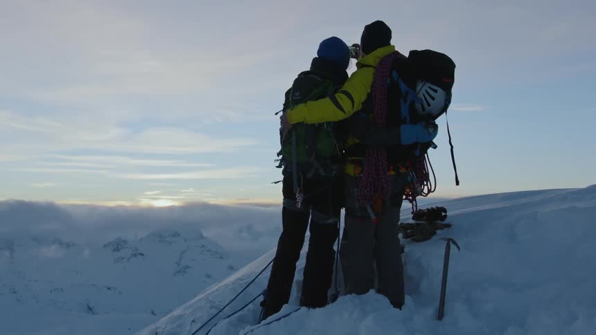 A couple take a selfie on the mountain