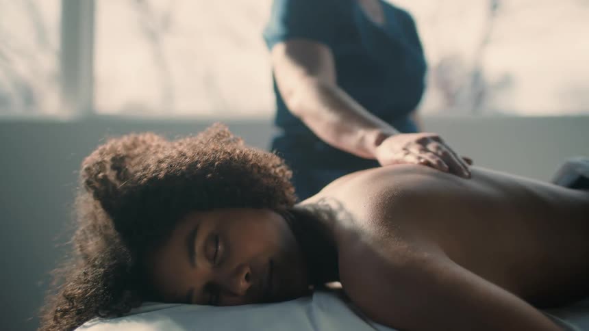 A woman is receiving a massage