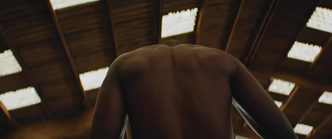 A man stretches under the skylight