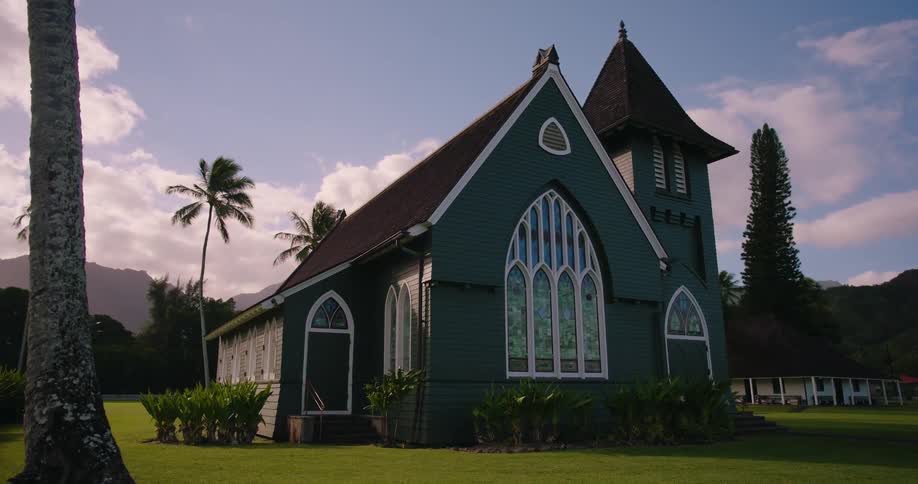 Small church on a beautiful green field in the morning