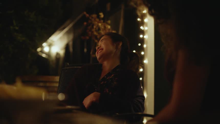 Friends laugh and talk outside
