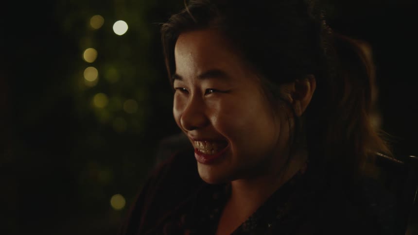 A woman is talking and laughing