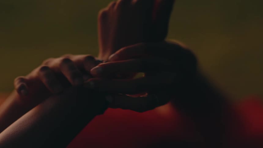 Hand holding the other hand and fixing bead