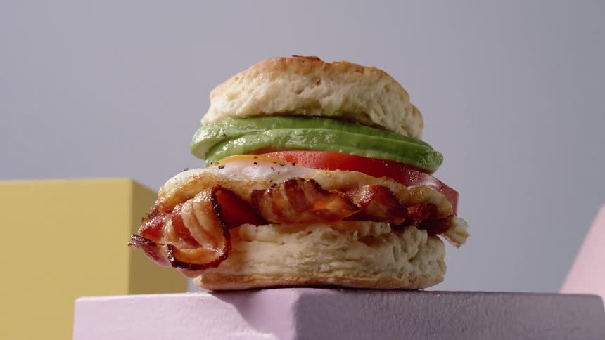 A sandwich on a biscuit is on display