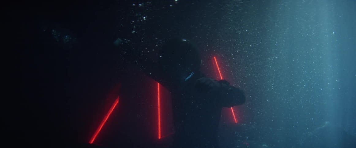 A person swimming down into the water