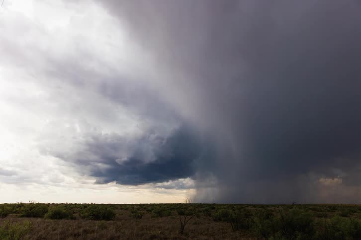 Ominous clouds are forming in the sky and appear to be swirling