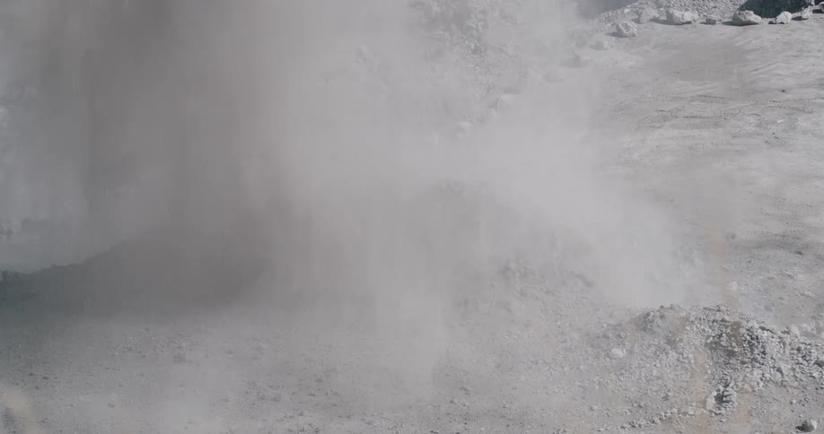 The ground explodes sending rocks everywhere