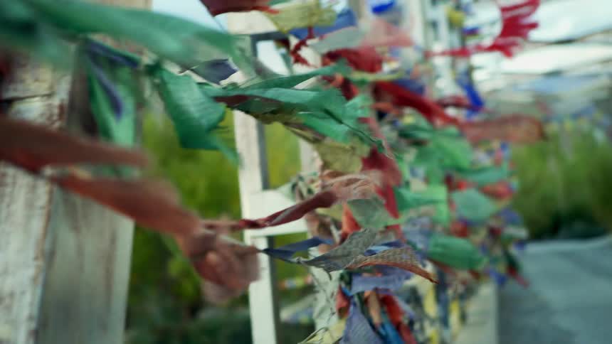 A view of banners blowing in the wind on a bridge