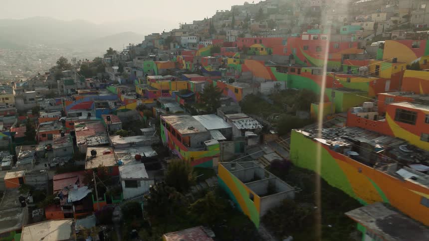 Aerial footage shows a hillside completely covered with countless buildings