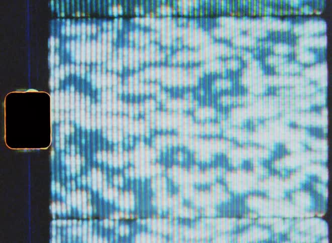 Film footage of a screen is displayed