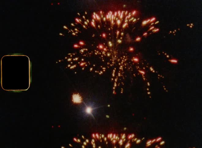Bright fireworks during the night on 8 mm film with high contrasts and lens flares