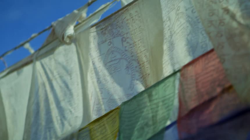 Colorful prayer flags waving in the wind