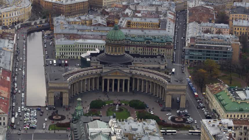 Aerial view of cars driving through a populated city