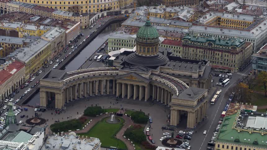 An aerial view of a large dome building in a city