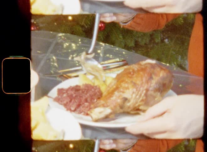 A young adult woman in an orange sweater uses a spoon to transfer food onto her own plate in front of a decorated X-mas tree with ornaments lights and décor during a family gathering celebrating togetherness and the holiday spirit on Christmas eve
