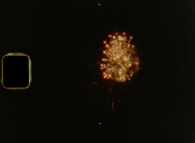 8mm film footage of bright rockets shooting into the sky during July 4th fireworks show