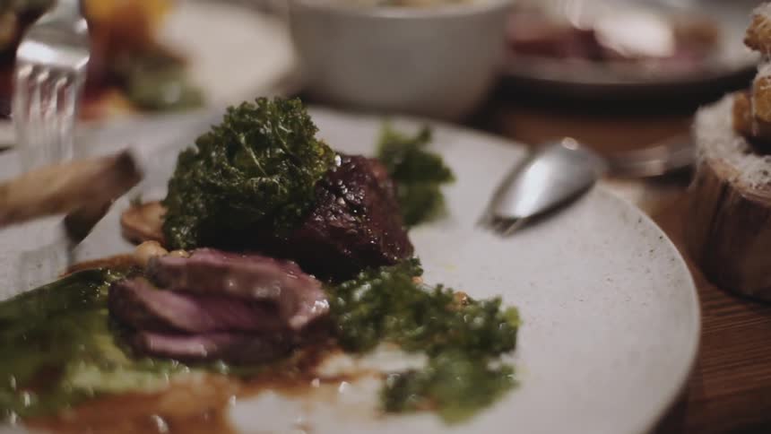 A person is eating from a plate