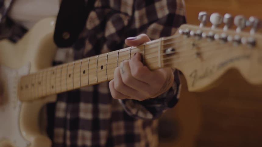 A person is playing the guitar
