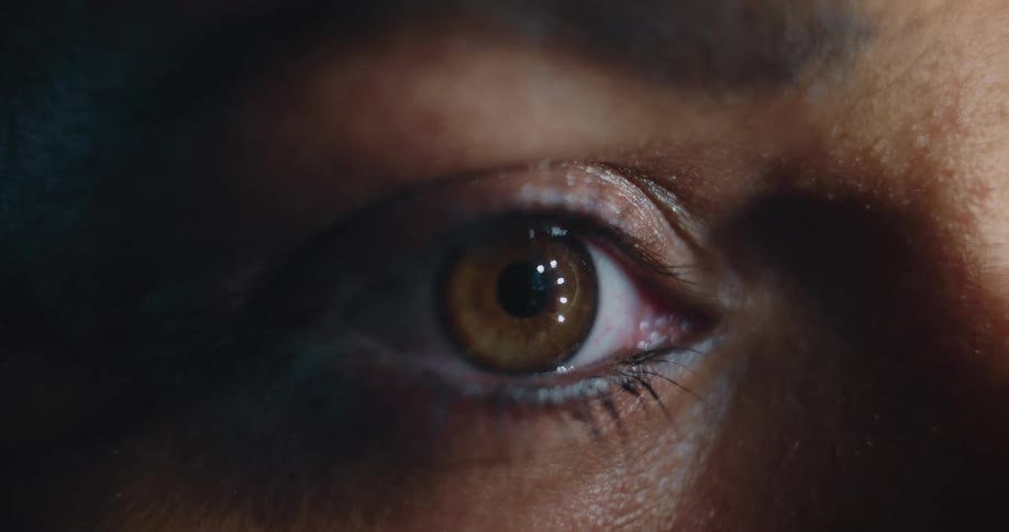 Light reflecting on the pupil of a blinking eye