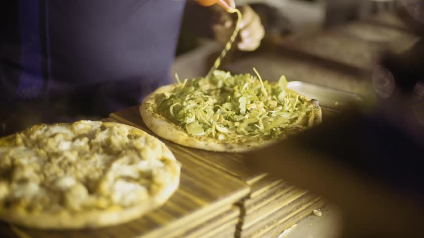 A man is making a pita bread meal