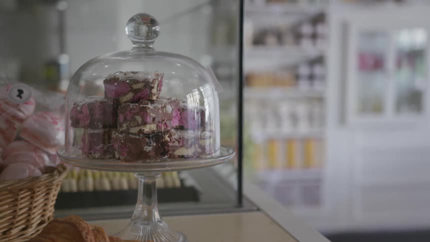 Pastries are displayed on this shop counter