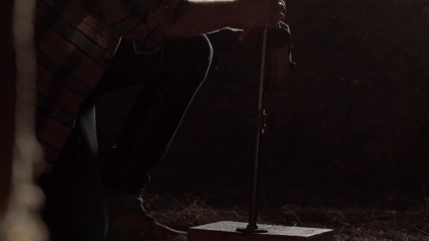 A person picks up a post