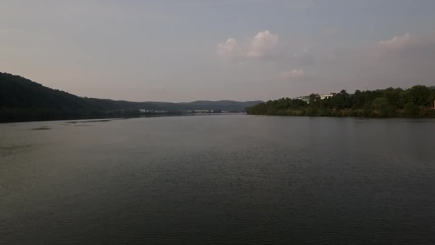 A wide body of water on a partly cloudy day