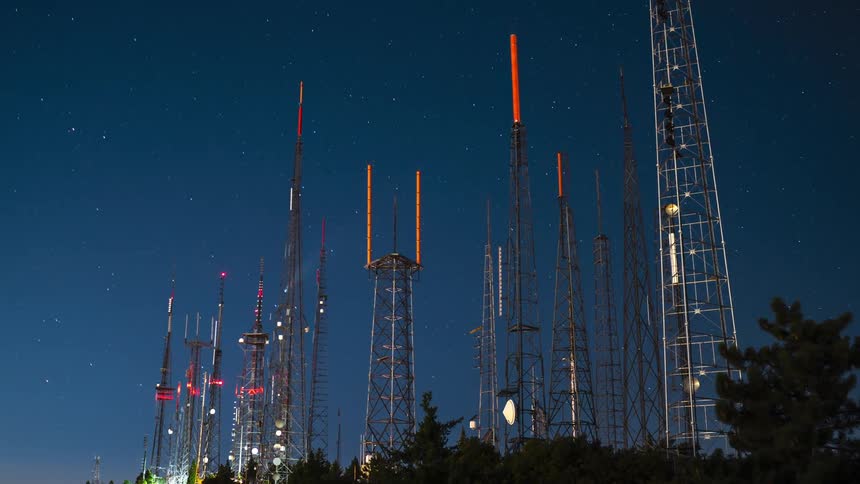 Transmission towers turn red as day turns to night