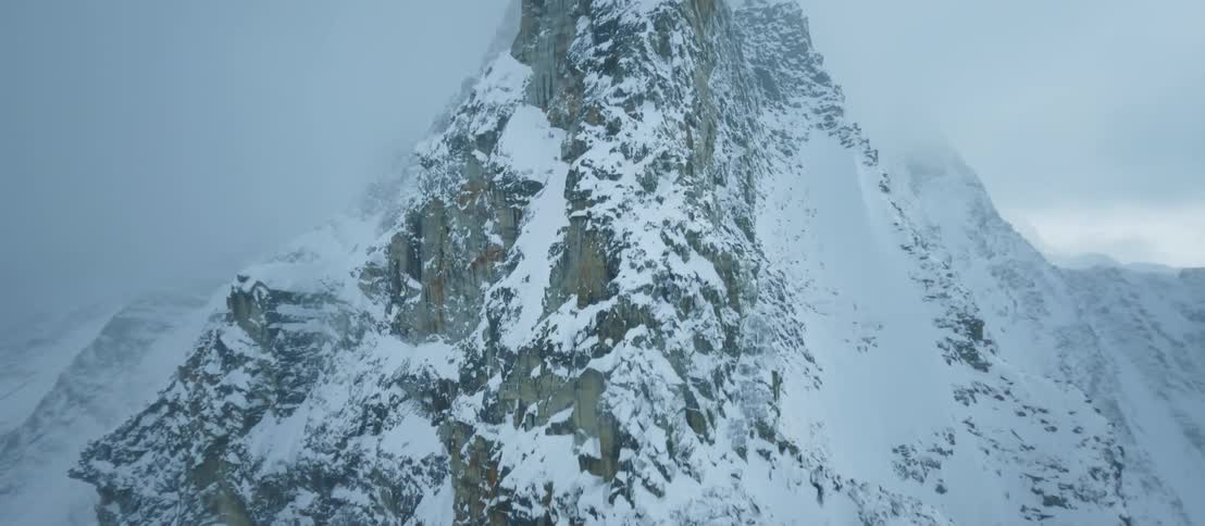 Aerial view of high snowy mountain ridge
