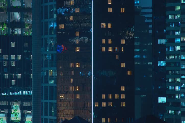 Time lapse of tall apartment buildings at night