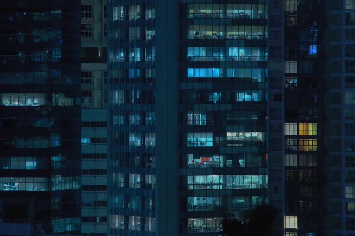 Time lapse of apartment buildings with flickering lights