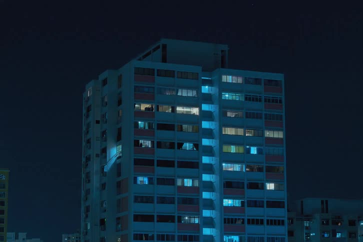 The lights blink in the apartments