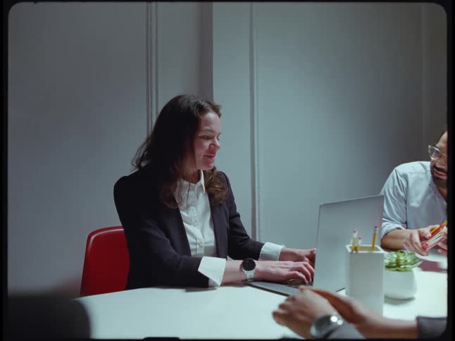 People from the office are sitting down and talking to each other