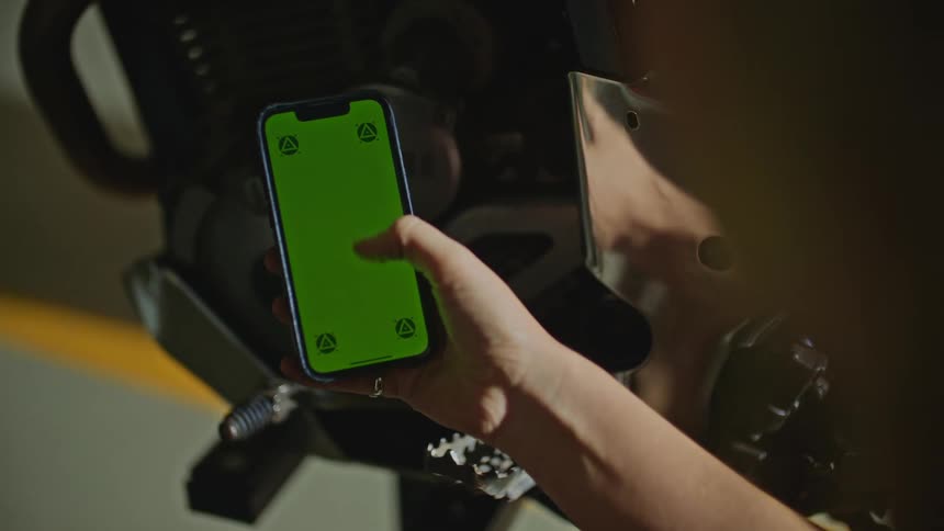 Woman with ring uses smartphone