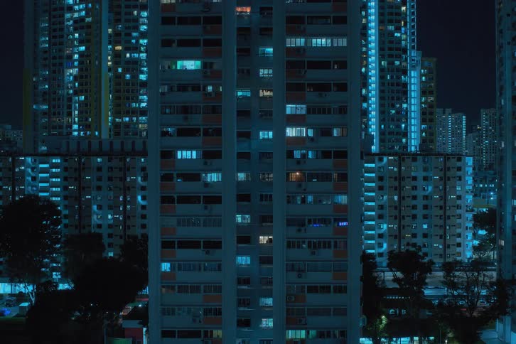 City lights twinkling from skyscrapers at night