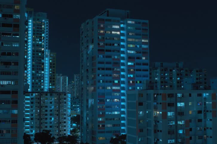 The lights blinking and flickering in the apartments