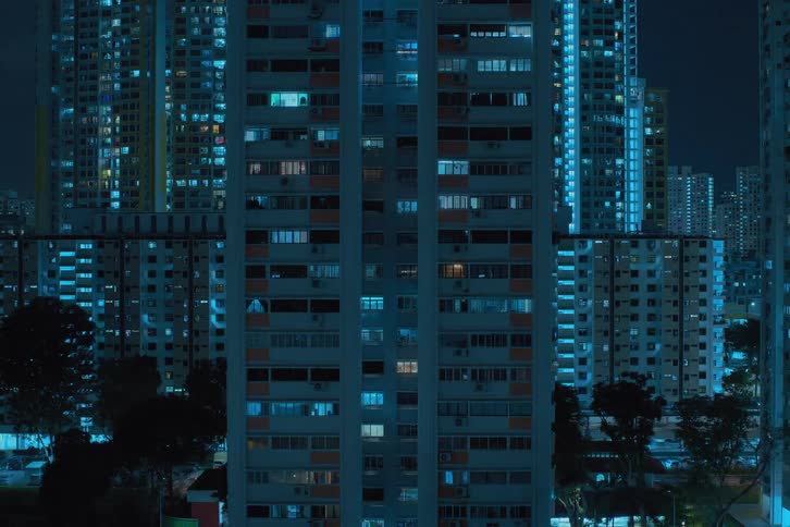 Lights shining from skyscraper windows in a city at night