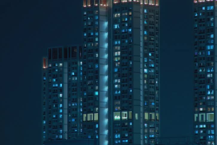 The window lights blink and flicker in the buildings
