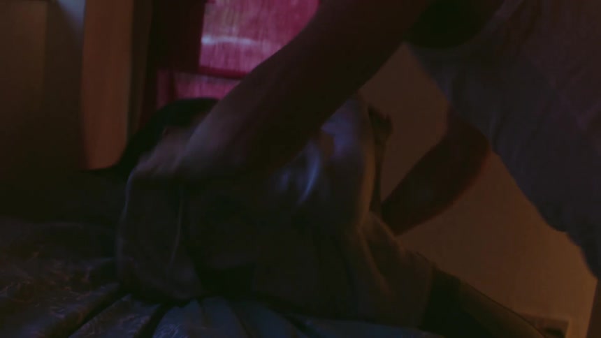 A man coming into a room aggressively and grabbing a woman and throwing her down angrily