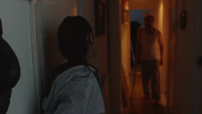 Woman arrives at home with bag and man limps down hall to confront her violently