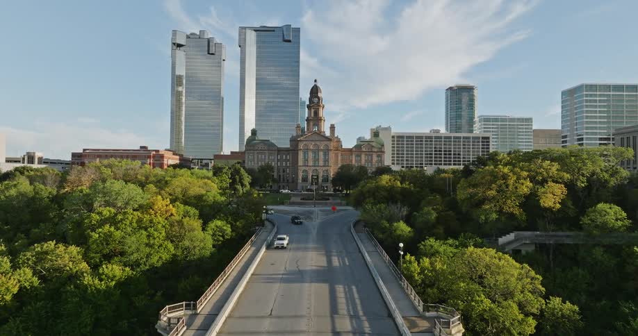 Cars travel on the bridge by the city