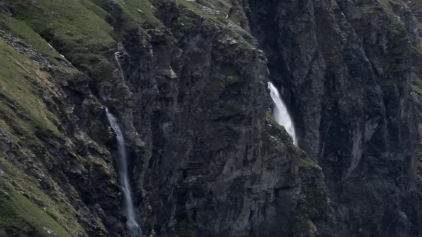 Waterfalls pour off the side of this mountain top