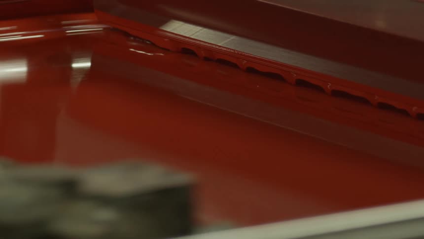 Machine parts move and apply colors
