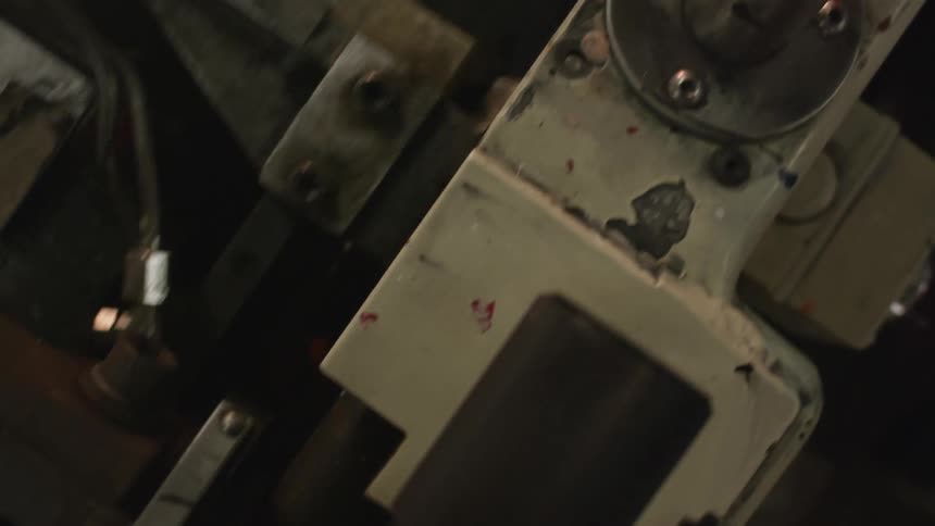 A factory machine is moving as it operates