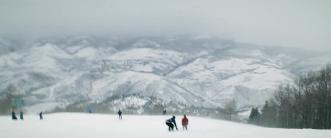 People are skiing on a slope