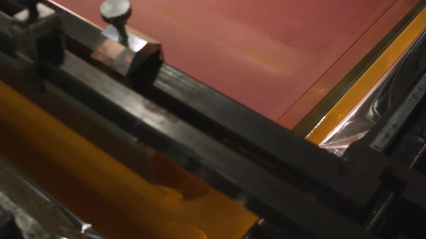 An up close of a machine rolling out paint
