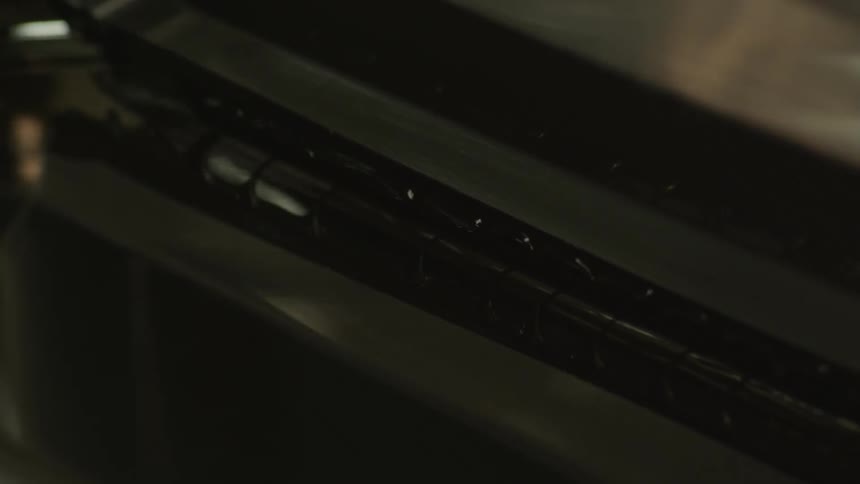 A machine in a factory closes and opens